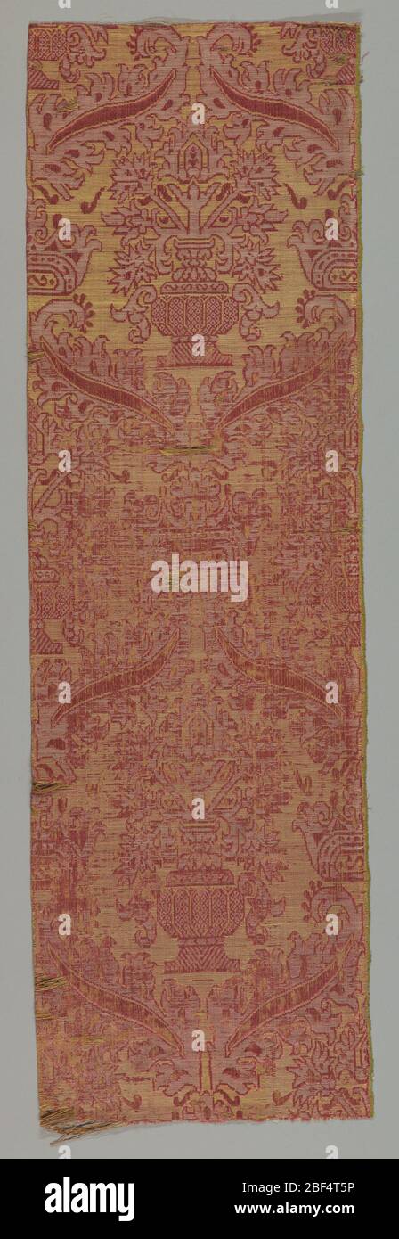 Tessile. Foglie scorrevoli e vaso centrale in rosso, bianco e giallo. Foto Stock