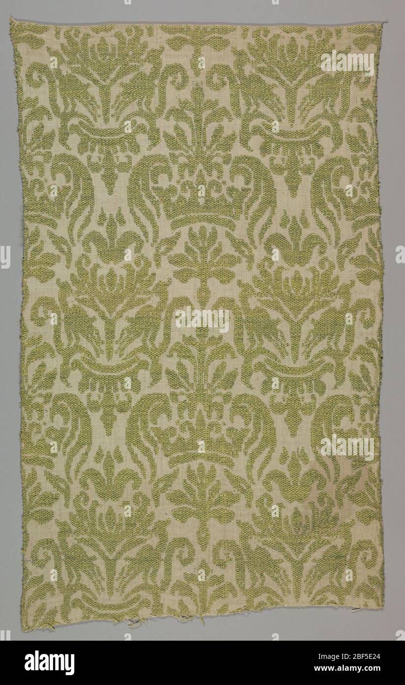 Tessile. Grande design allover con corona reale francese e gigli araldici in verde chiaro su terreno bianco. Foto Stock