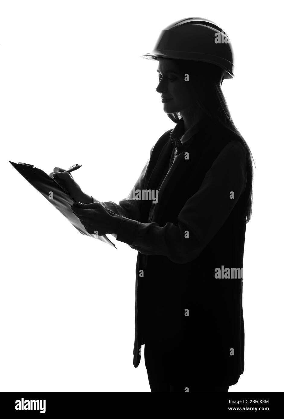 Silhouette di ingegnere femminile su sfondo bianco Foto Stock