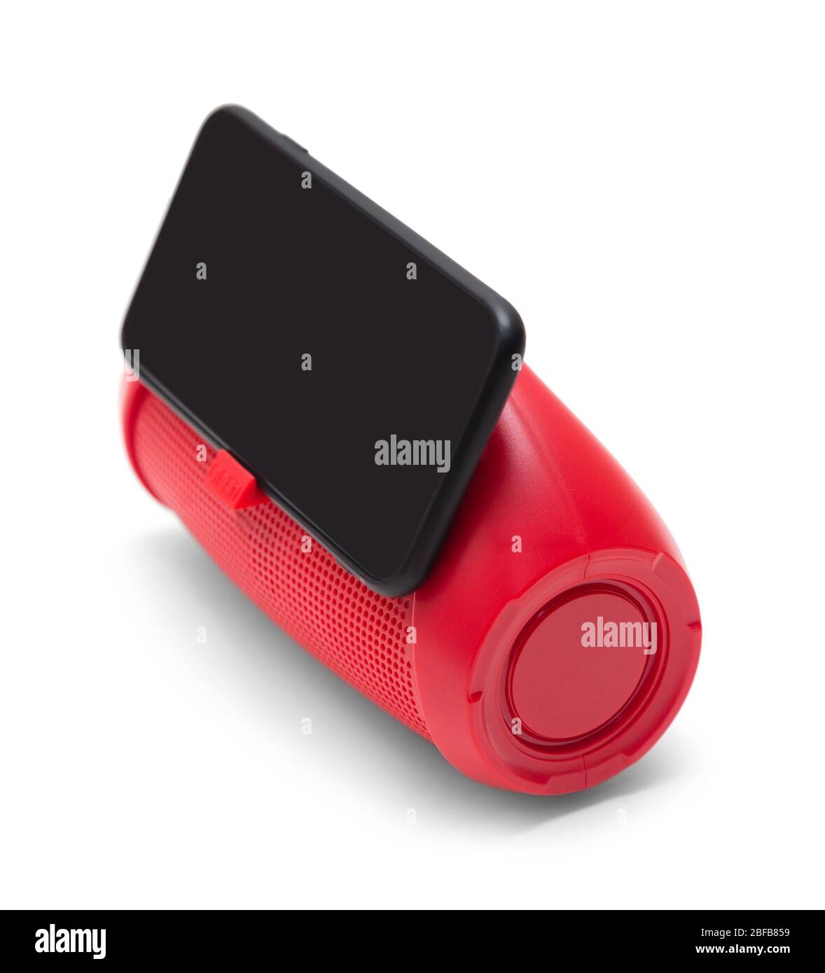 stereo portatile con altoparlante rosso per telefono cellulare con supporto per telefono e smarthone isolato su sfondo bianco vista laterale Foto Stock