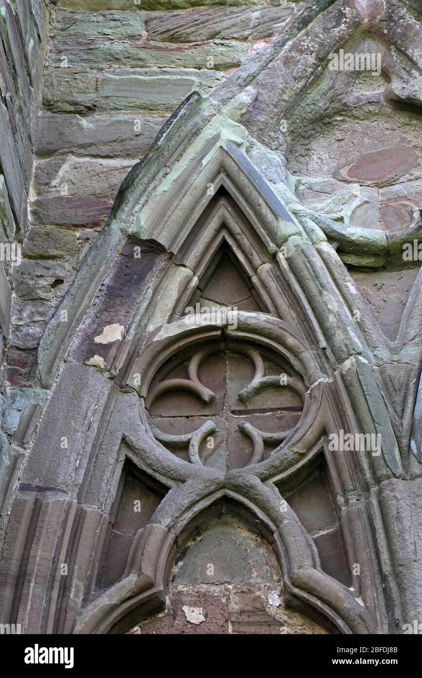 Decorazioni a parete su Tintern Abbey, Monmouthshire, Galles Foto Stock