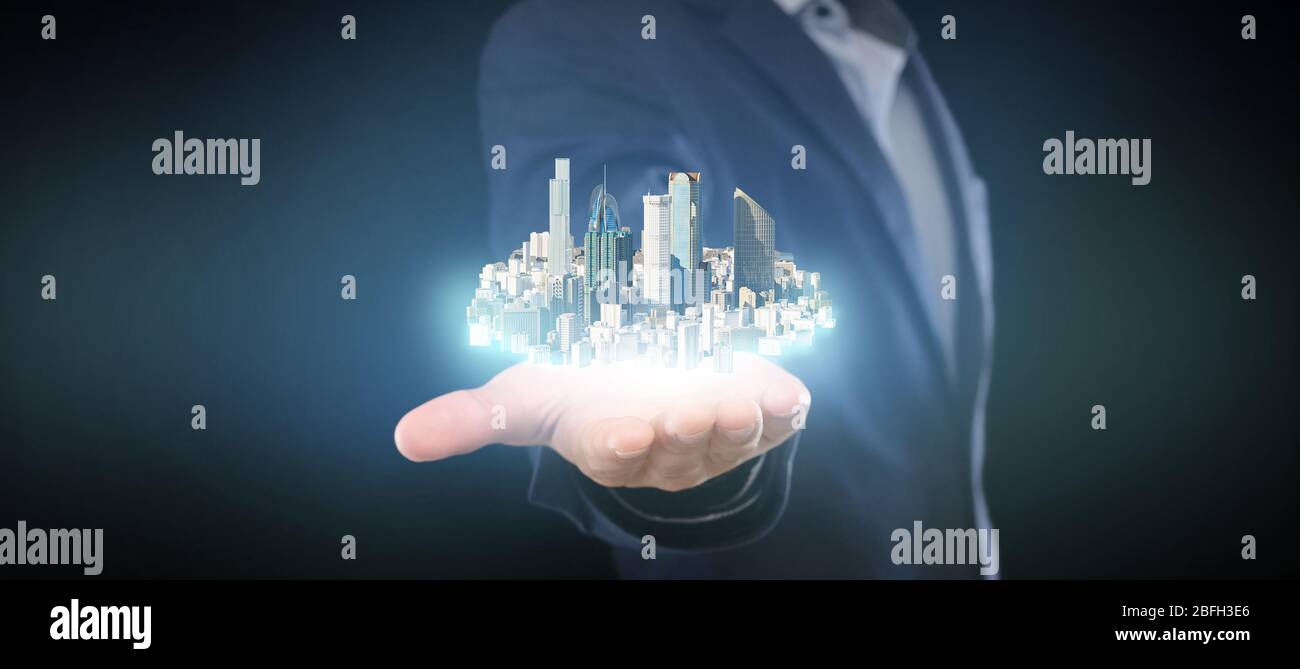 L'uomo in tuta tiene la città sulla sua mano, ologramma a doppia esposizione Foto Stock
