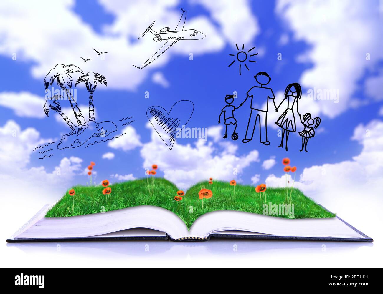 Apri il libro con disegni su sfondo cielo Foto Stock