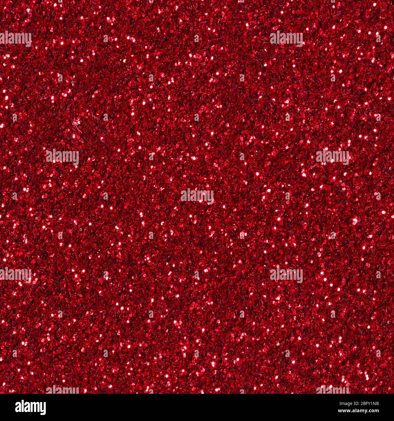 Rosso glitter texture sfondo di natale. Struttura quadrata senza cuciture. Foto Stock