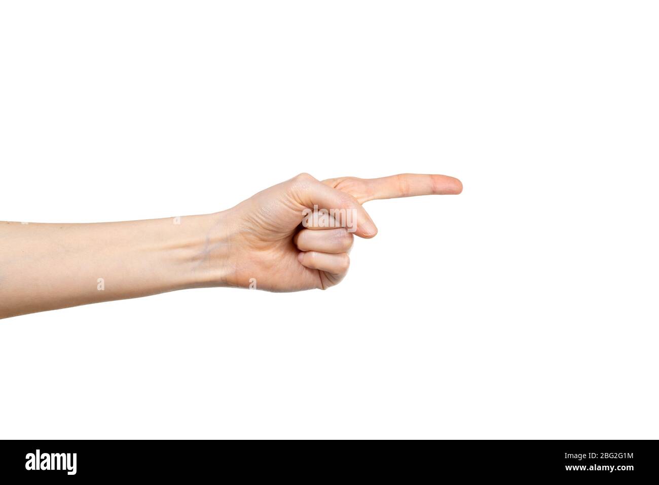Primo piano della mano femminile che punta isolata su sfondo bianco. Gesto della mano. Concetto di gesticulazione. Foto Stock