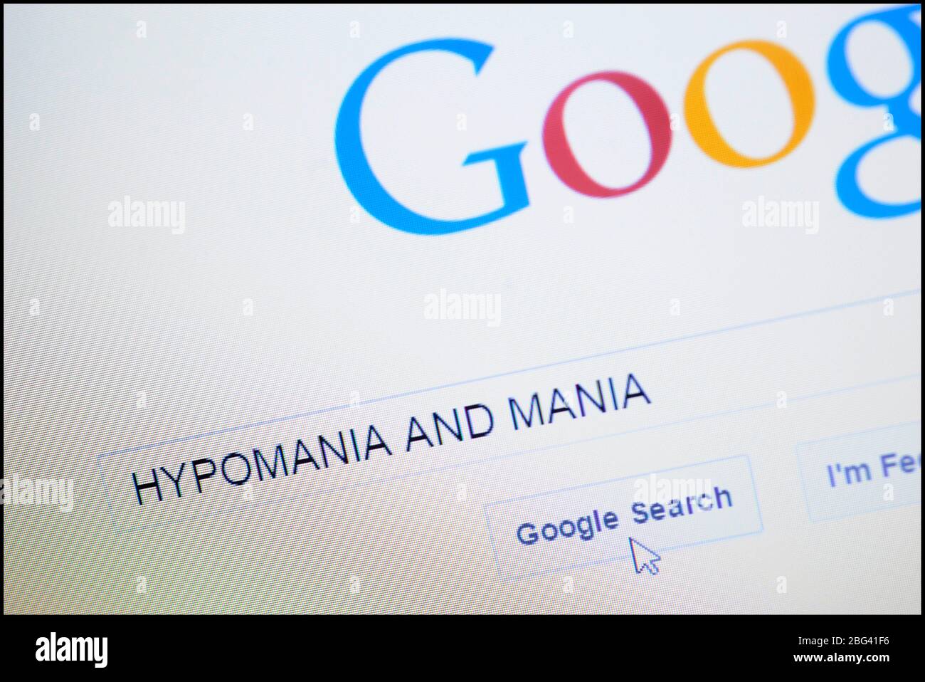 Hypomania e Mania digitati nella barra di ricerca sulla homepage di Google Foto Stock
