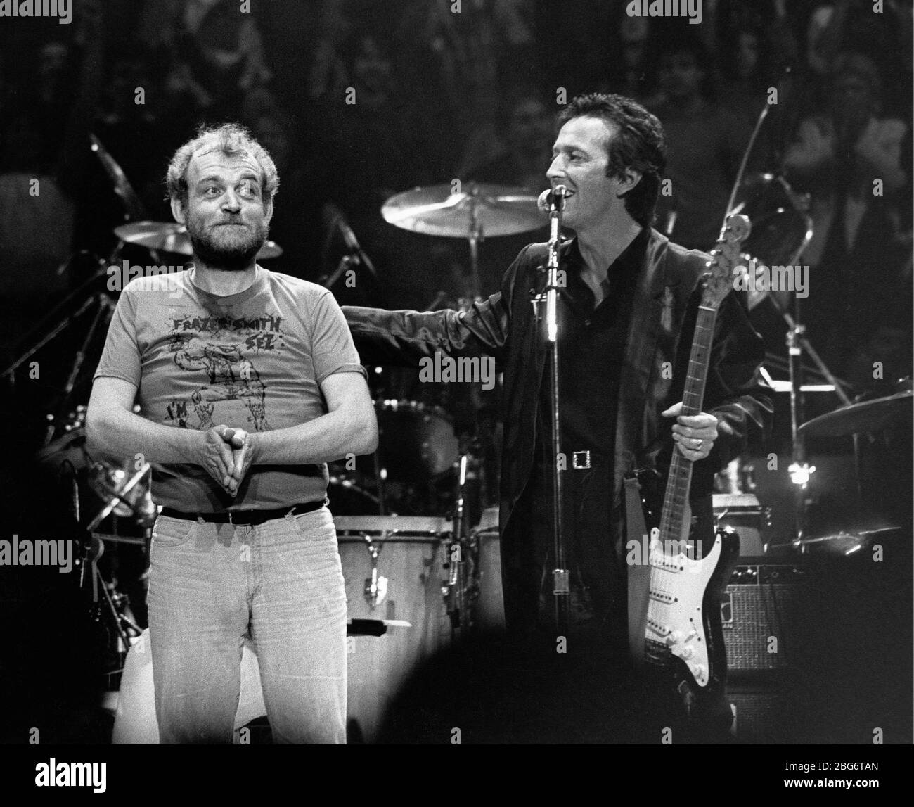 Eric Clapton, Joe Cocker e Bill Wyman (non illustrato) che si esibiscono insieme alle ARMI (azione nella ricerca per la sclerosi multipla) Concerto di beneficenza al Madison Square Garden a New York City il 17 dicembre 1983. Credito: Scott Weiner/MediaPunch Foto Stock
