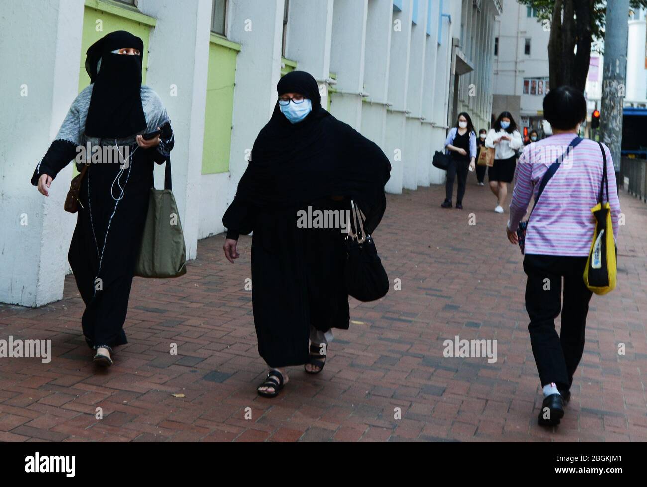 Una donna musulmana velata a Hong Kong. Foto Stock