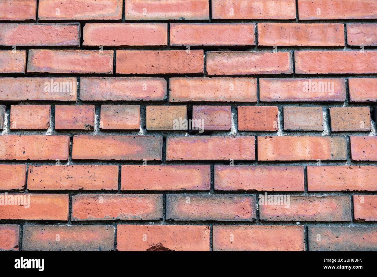 Foto ravvicinata di un muro di mattoni rossi Foto Stock