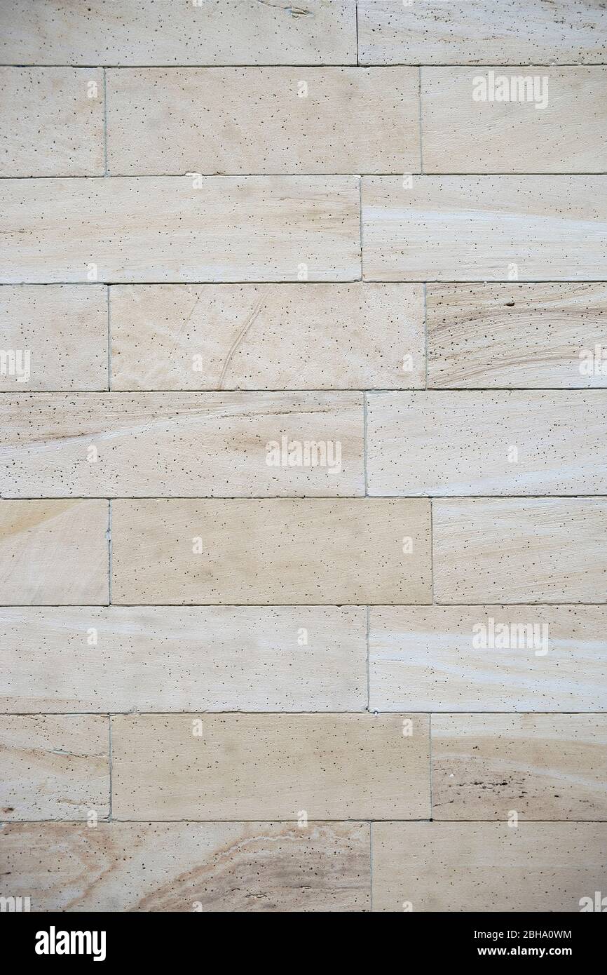Un beige chiaro rivestimento realizzato in marmo di arenaria con pori. Foto Stock