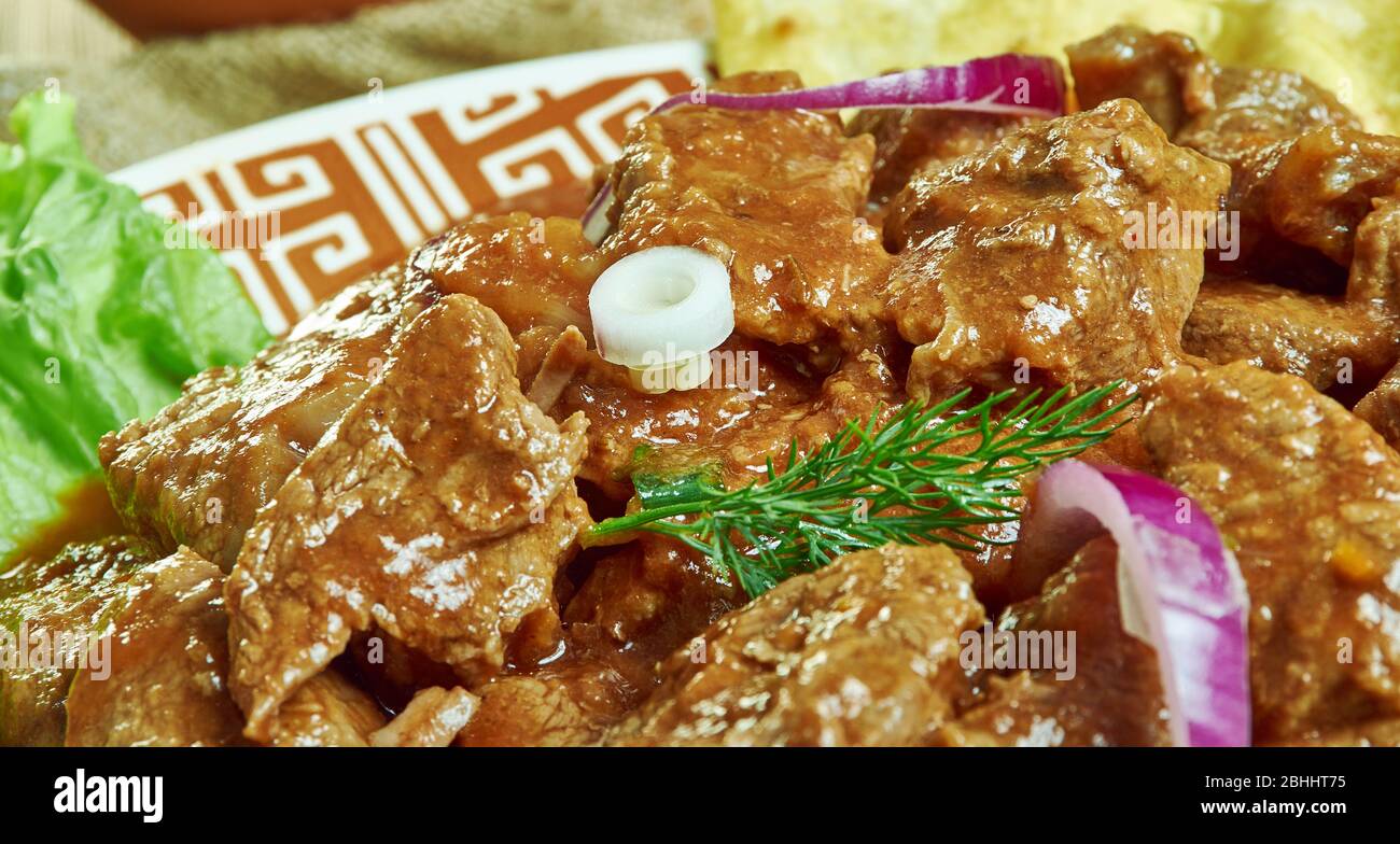 Mutton Lazeez, Mutton Chops Masala, cucinato in spezie mite, mescolato in yogurt e crema. Foto Stock