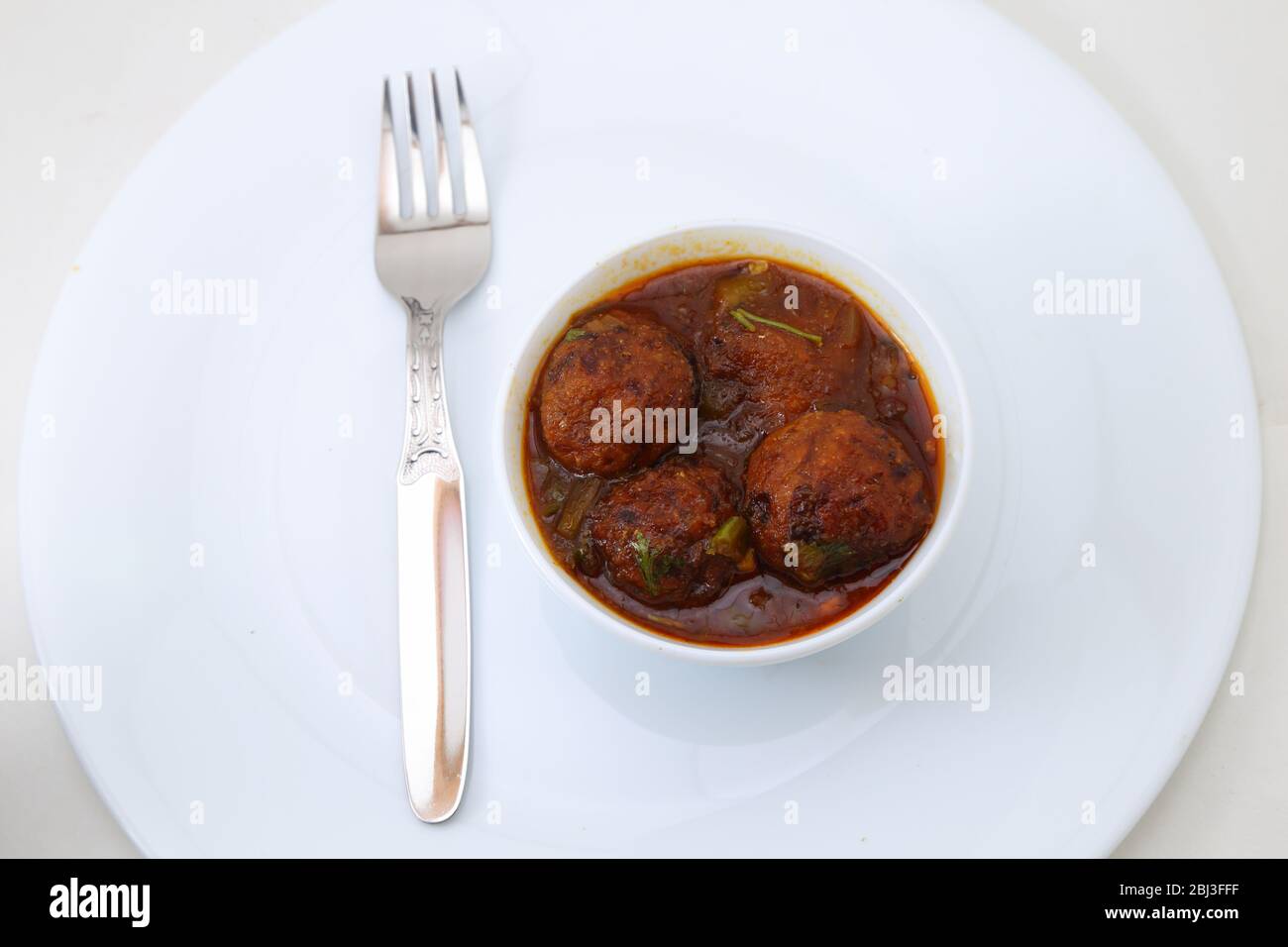 Manchurian con sugo Foto Stock