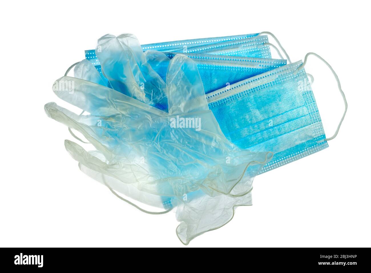 Guanti e maschere facciali/maschere facciali monouso in plastica trasparente per evitare la diffusione di germi durante la pandemia del virus COVID-19/coronavirus/corona Foto Stock