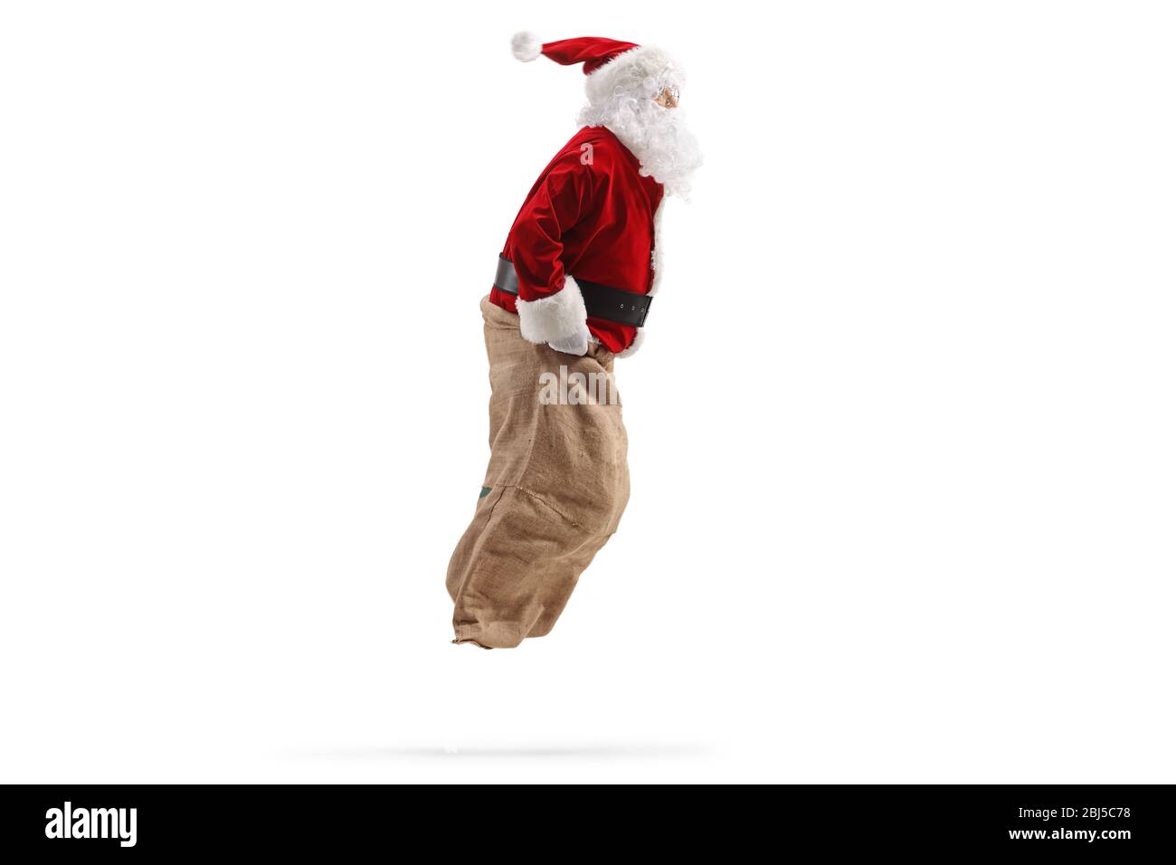 Foto di Babbo Natale che salta all'interno di un sacco isolato su bianco backgorund Foto Stock