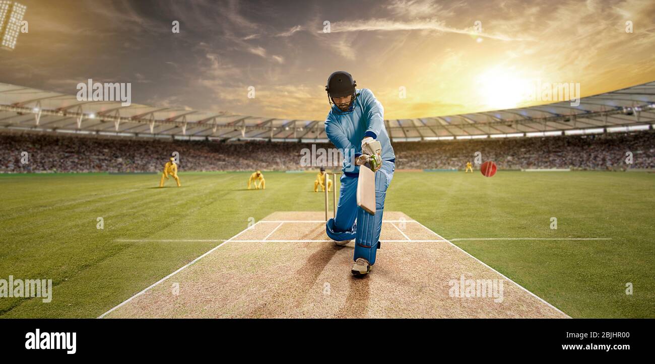 Giovane sportivo che batte nel campo di cricket Foto Stock