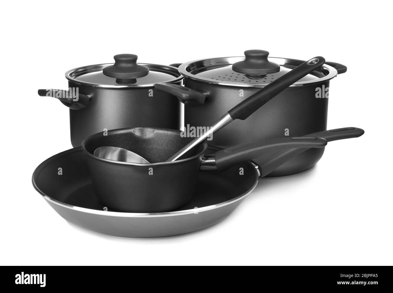 Diversi utensili di cottura su sfondo bianco Foto Stock