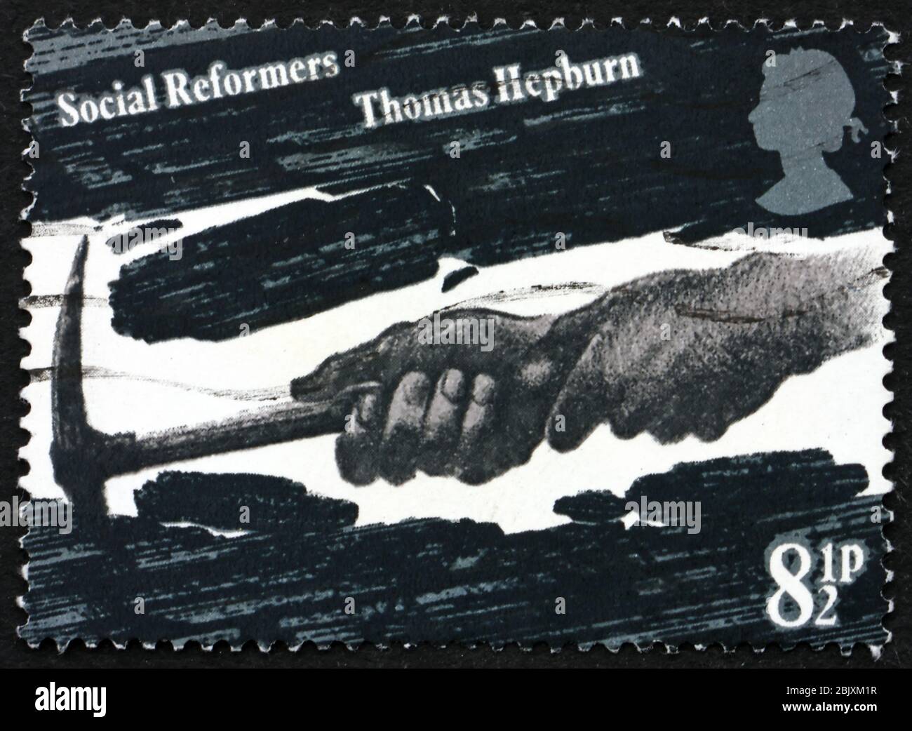 GRAN BRETAGNA - CIRCA 1976: Un francobollo stampato in Gran Bretagna mostra le mani di Coal Miner, dedicato a Thomas Hepburn, riformatore sociale, circa 1976 Foto Stock