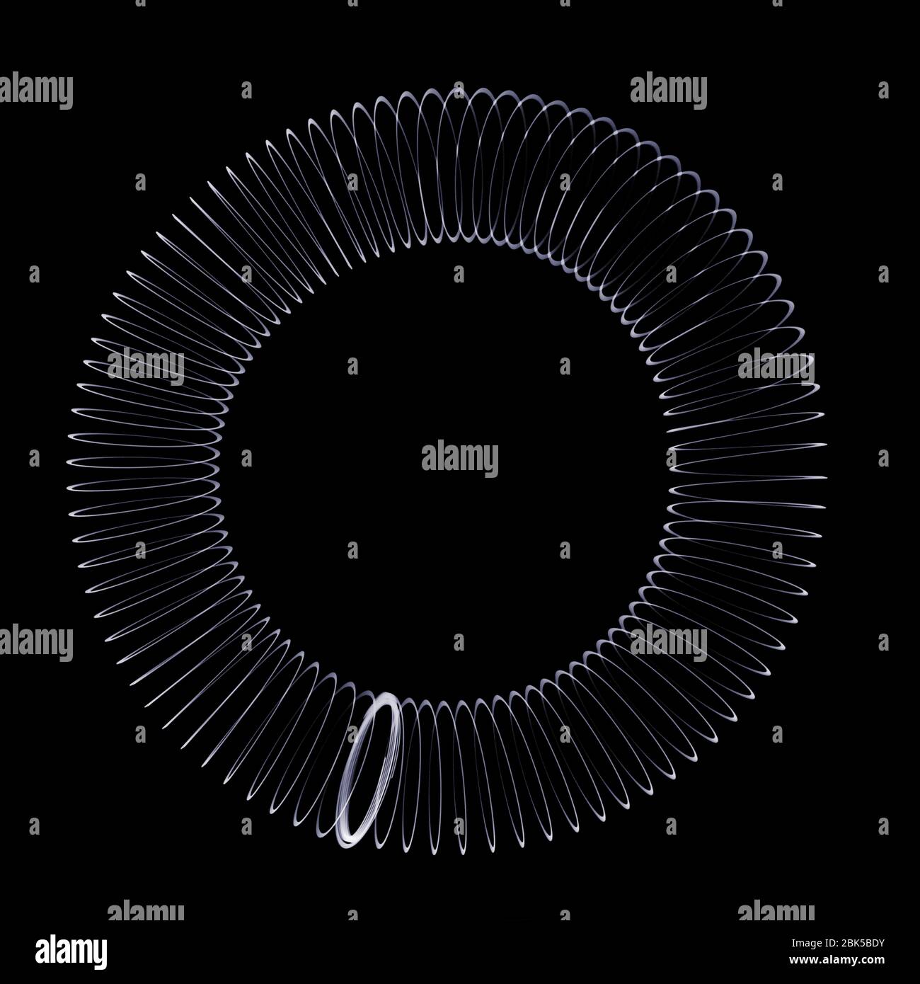 Slinky in un cerchio, raggi X. Foto Stock