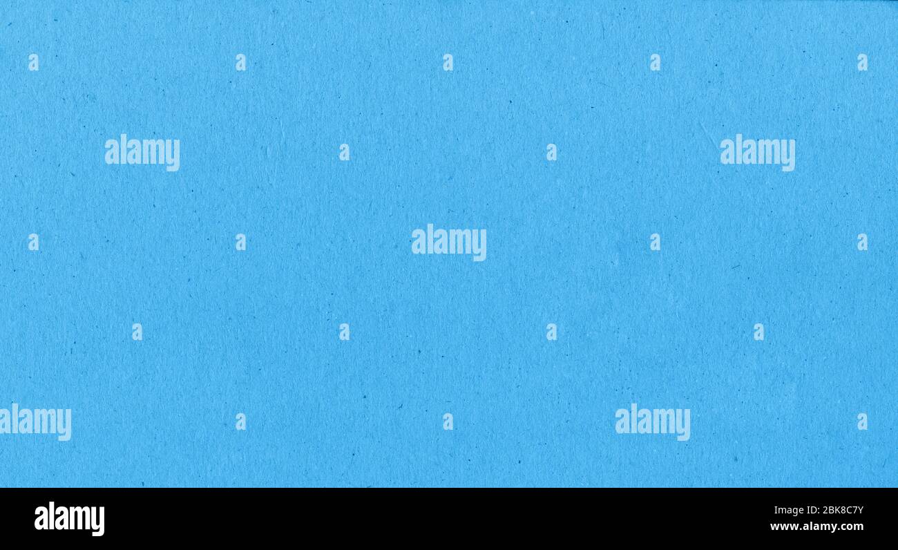 Uno sfondo fibroso di carta con un sacco di texture in blu Foto Stock