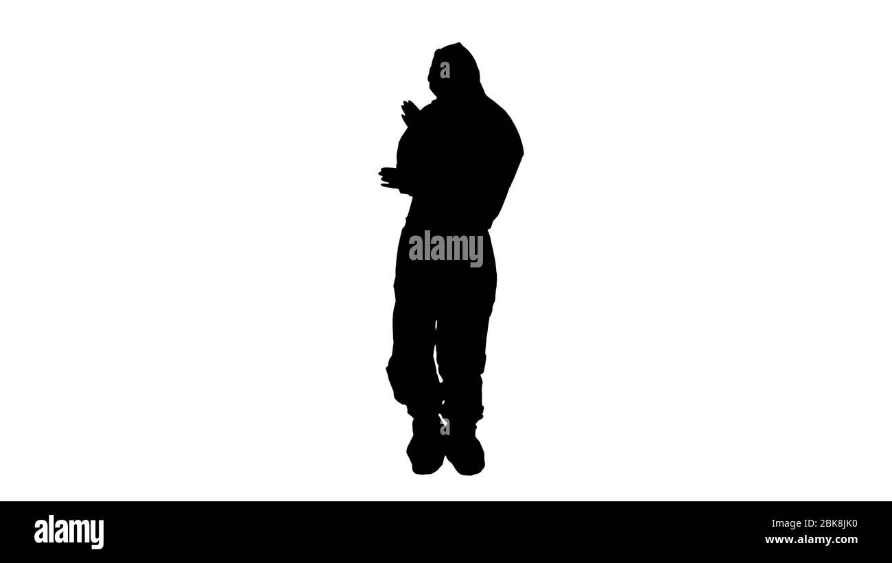 Silhouette Doctor in tuta protettiva che danza in modo divertente. Concetto di Covid-19. Foto Stock