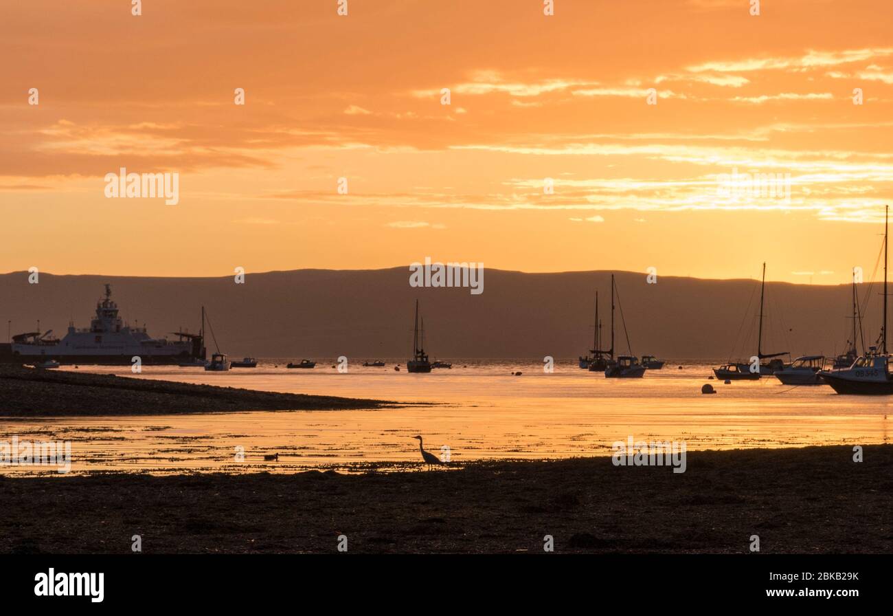 baia di lochranza al tramonto Foto Stock