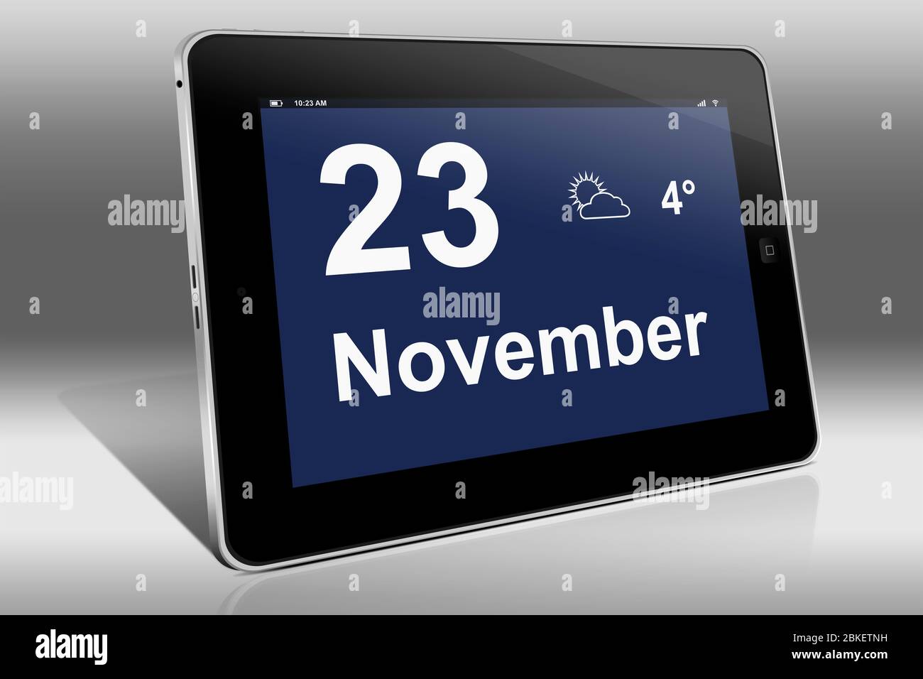 Un tablet visualizza un calendario in lingua tedesca con la data 23 novembre | Ein Tablet-computer zeigt das Datum 23. Novembre Foto Stock
