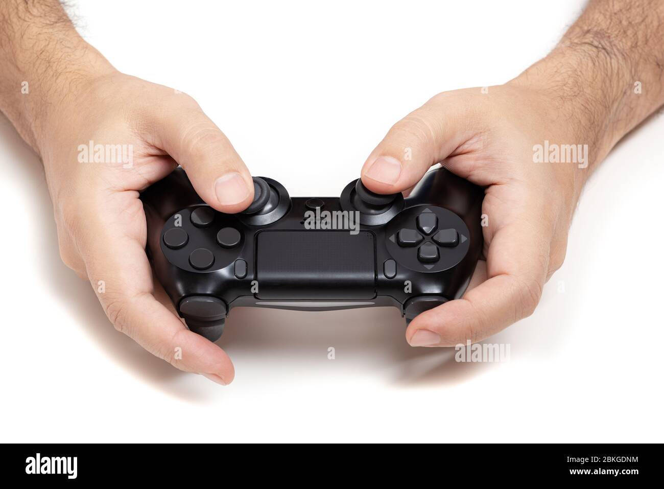 Controller per videogiochi su sfondo bianco a mani Foto Stock
