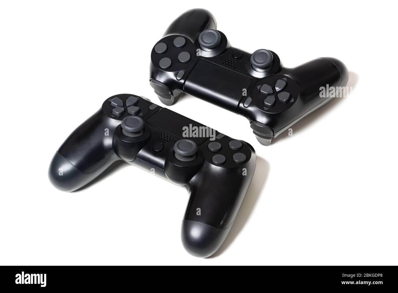 Coppia di controller di videogiochi neri sfondo bianco Foto Stock