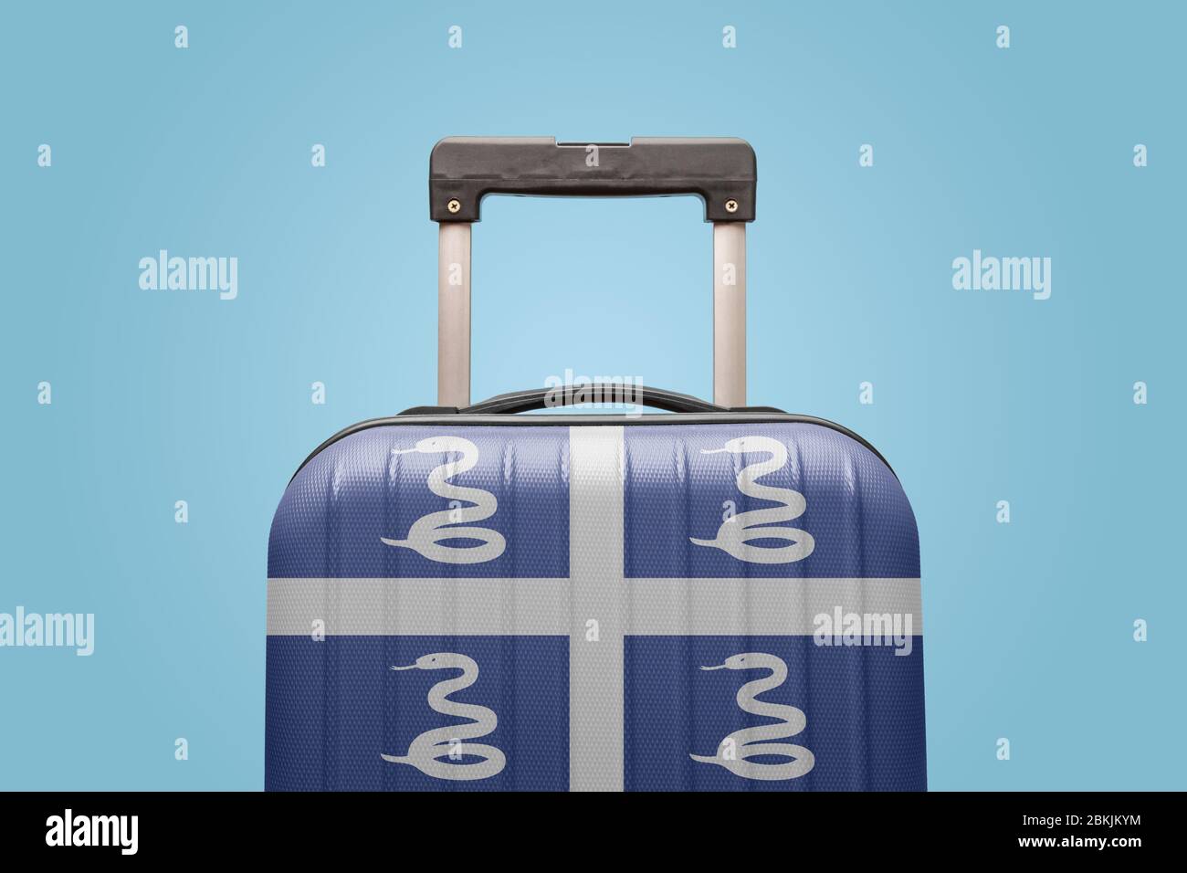 Valigia con bandiera Martinica design viaggio Caraibi America concetto. Foto Stock