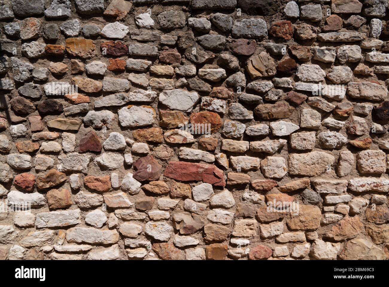 sfondo tessitura parete di pietra ocra Foto Stock