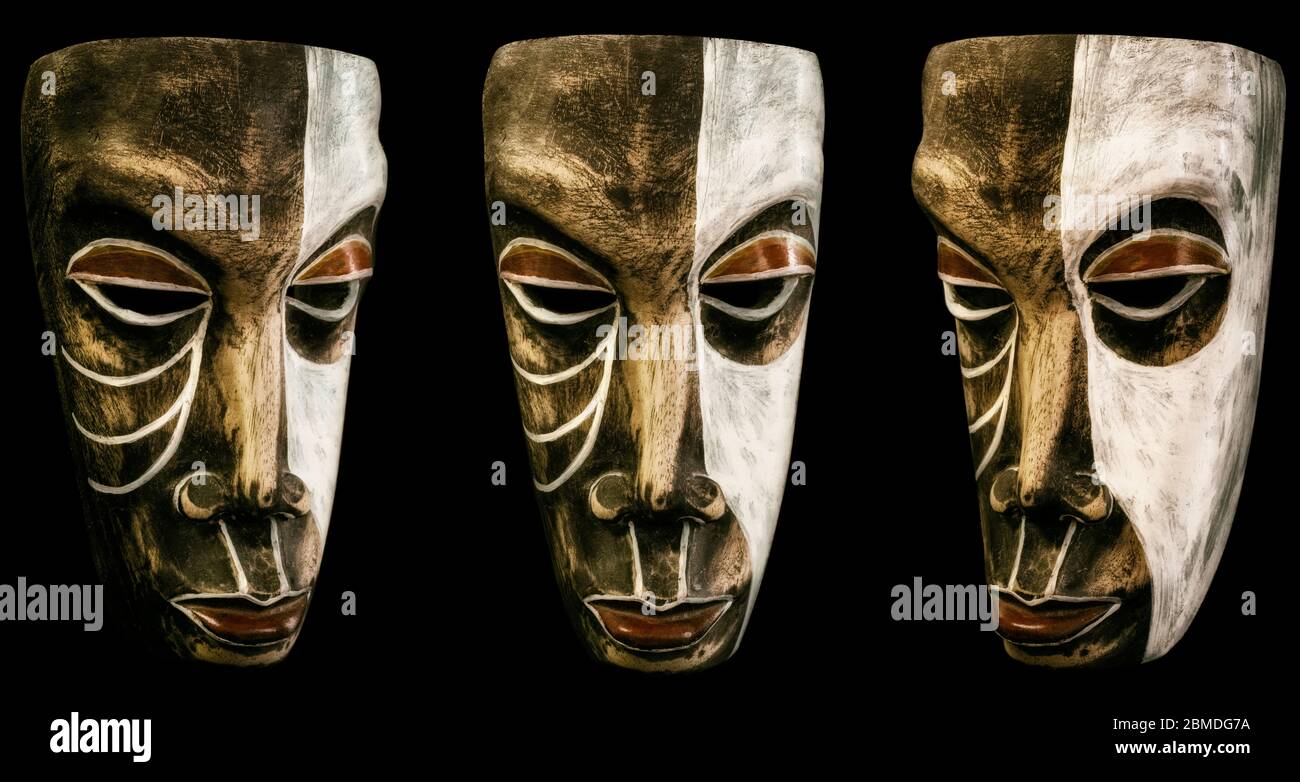 Maschera di legno intagliata dipinta - 3 angoli assemblati su sfondo omogeneo Foto Stock