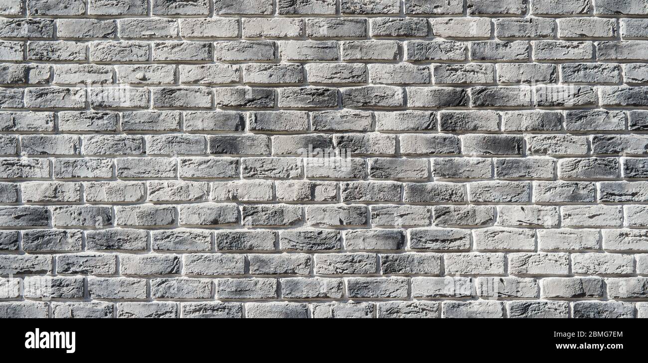 Muro di mattoni grigi. Muro di mattoni fatto a mano. Foto Stock