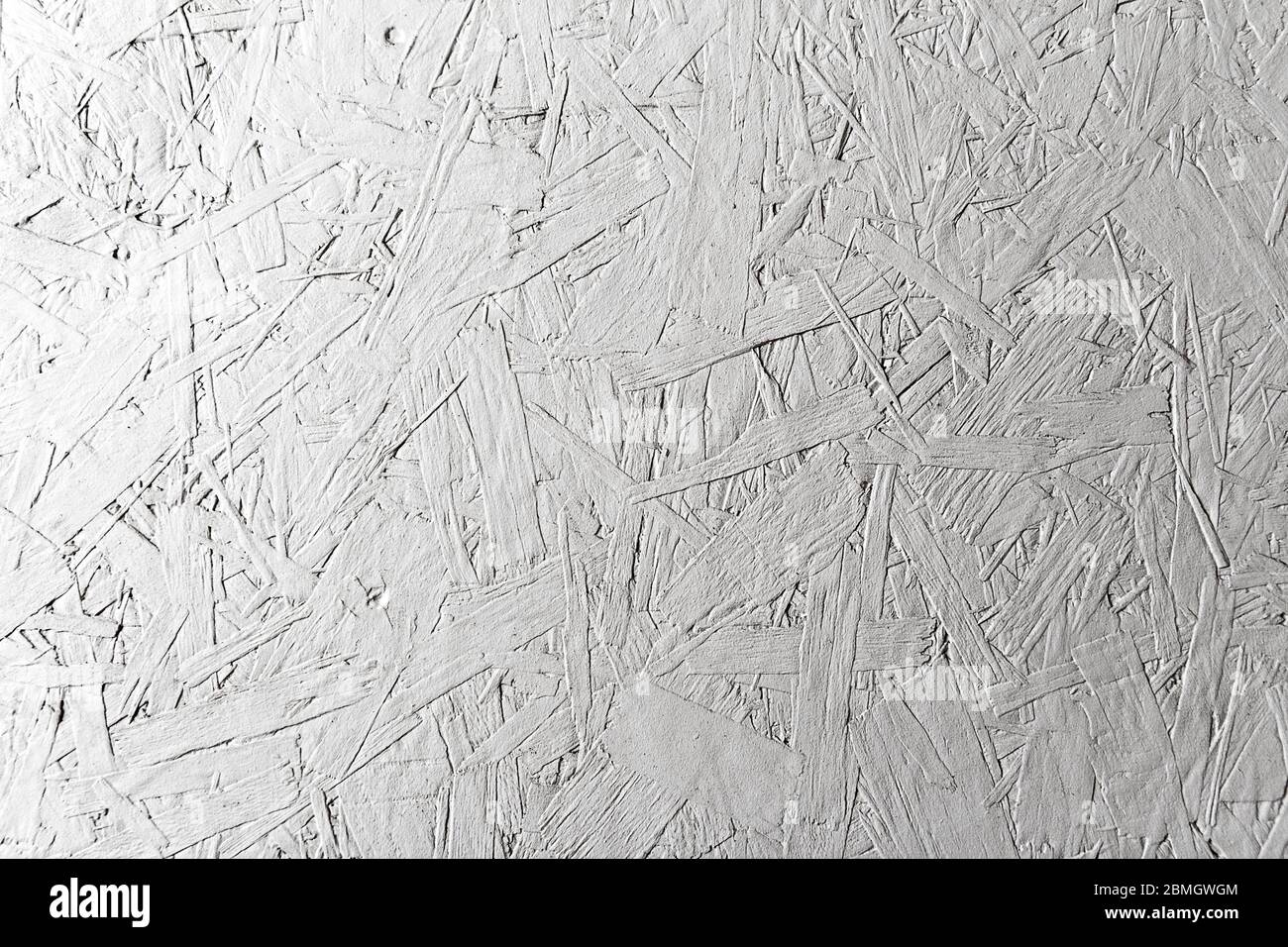 Il pannello esterno OSB verniciato bianco ha una grande texture di dettaglio casuale per l'uso in immagini digitali composite o come sfondo e per pareti anche Foto Stock