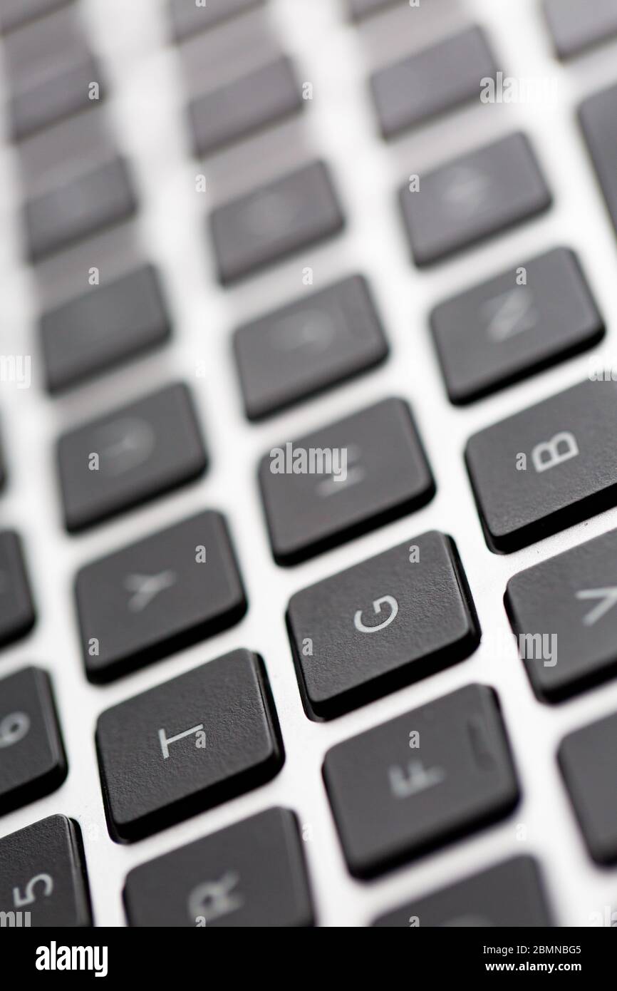 Tasti della tastiera del computer ravvicinati con effetto bokeh profondità di campo bassa Foto Stock