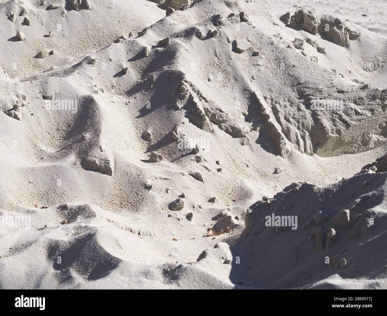 Impilato in su fine bianco sabbia materiale da costruzione Closeup Foto Stock