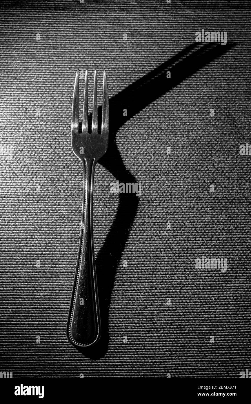 Ombra di una forchetta da mangiare Foto Stock