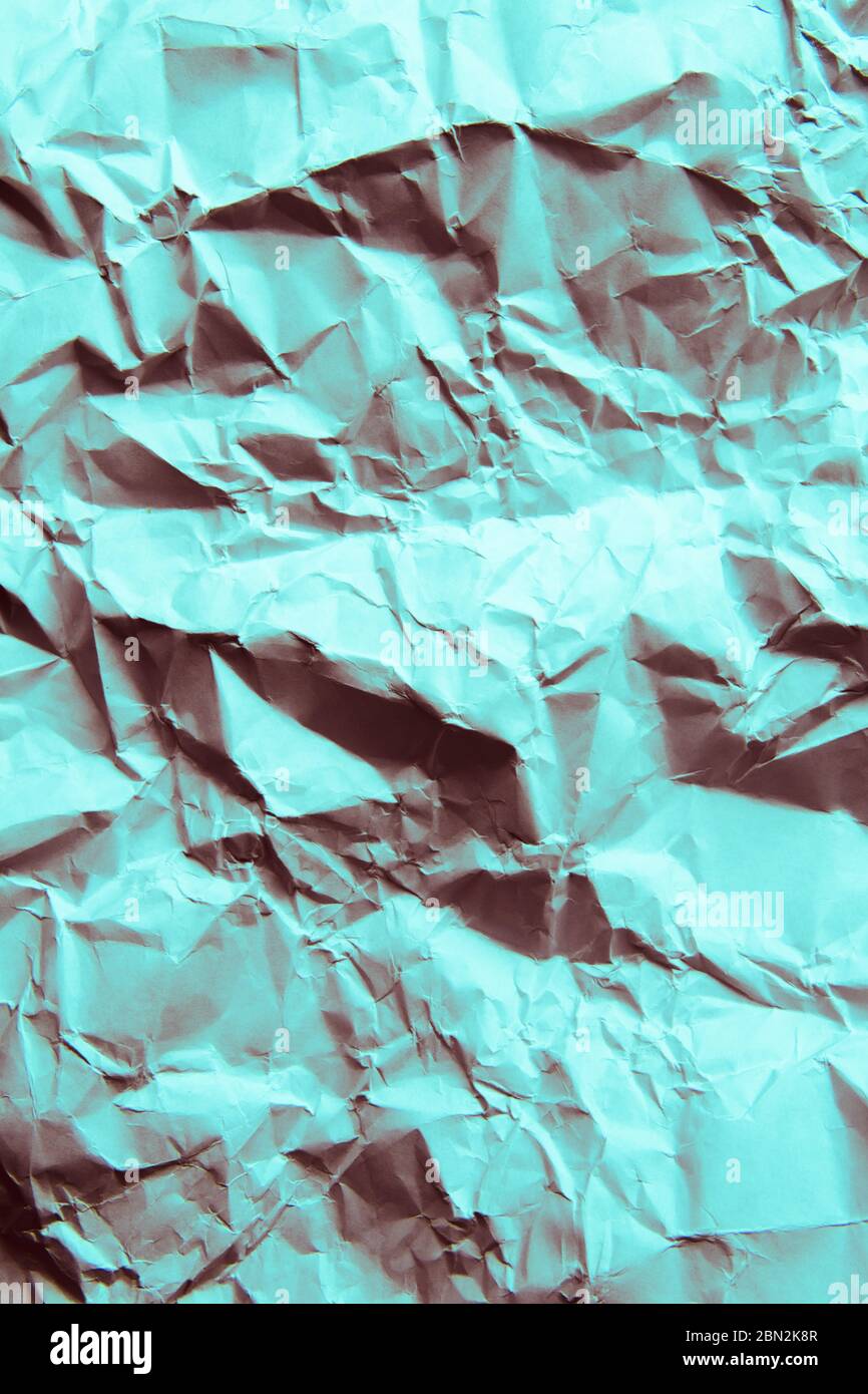 Sfondo di carta sgualcito. Colore verde chiaro. Foto Stock