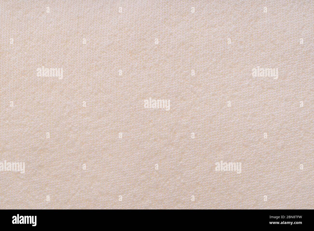 Tessuto di cotone beige fondo tessuto, senza cuciture motivo di tessuto naturale. Cura della pelle tessuto bagno lavaggio guanto texture. Guanto esfoliante per massaggio Foto Stock