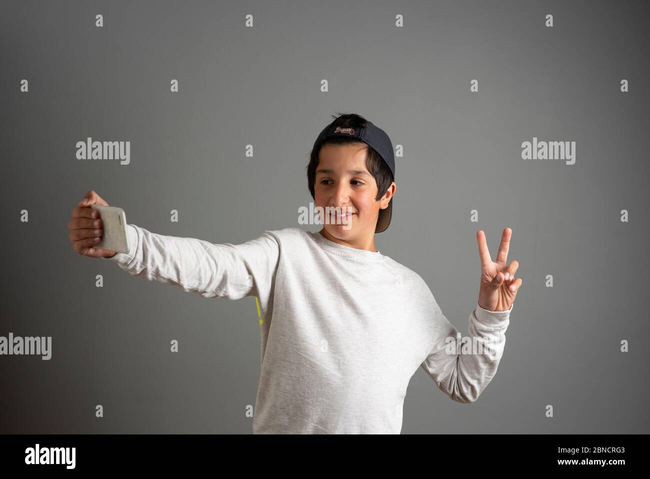 Ragazzo adolescente in videochiamata Foto Stock