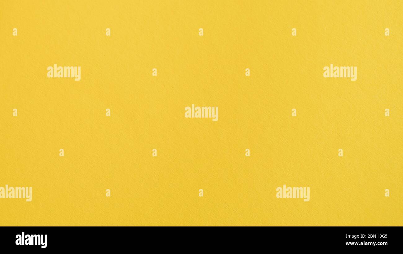 Sfondo giallo. Sfondo di carta giallo. Sfondo cromato. Ambra, limone, arancio, sfondo di zafferano e spazio di testo Foto Stock