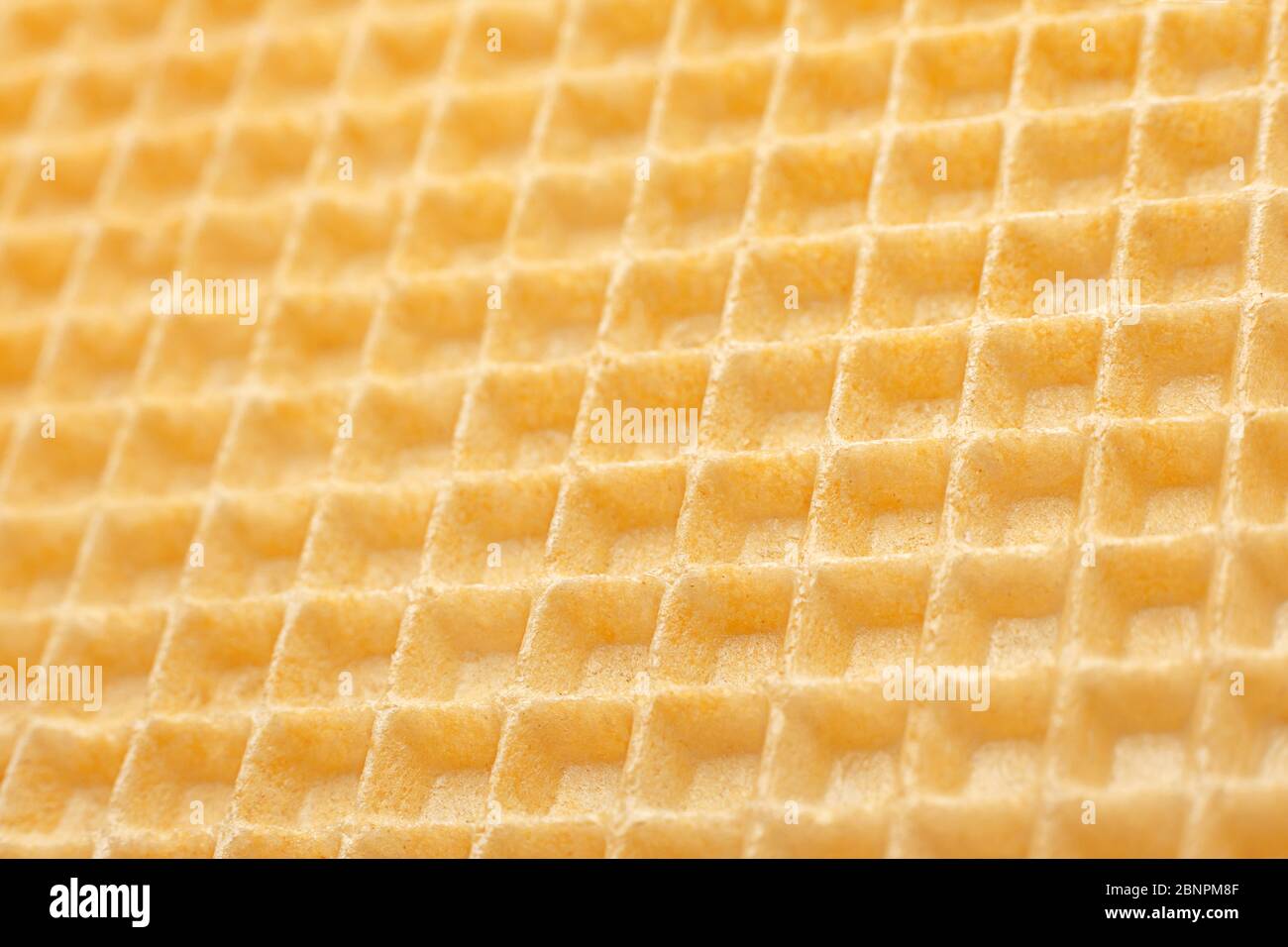 Waffle gialli superficie primo piano dettaglio sfondo Foto Stock