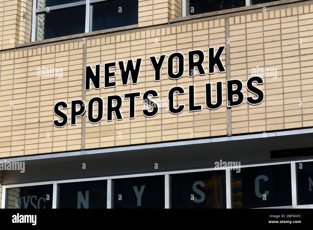 Segnaletica del New York Sports Club su un muro di mattoni a New York, NY Foto Stock