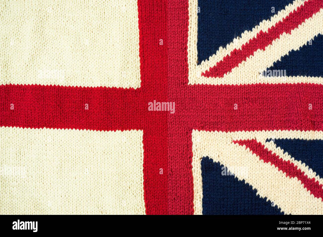 St Georges Cross e Union Flag, a metà, lavorato a mano in lana Foto Stock