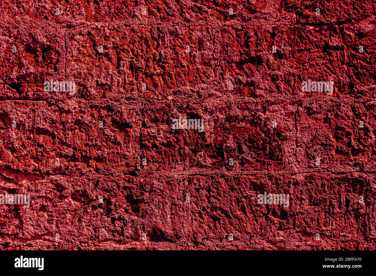 Crimson arenaria muratura per sfondo Foto Stock