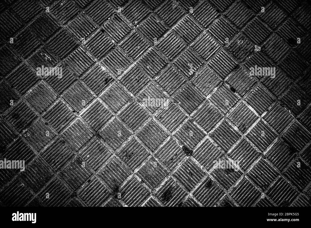 Pietre per pavimentazione in strada, dettaglio sul marciapiede per i pedoni Foto Stock