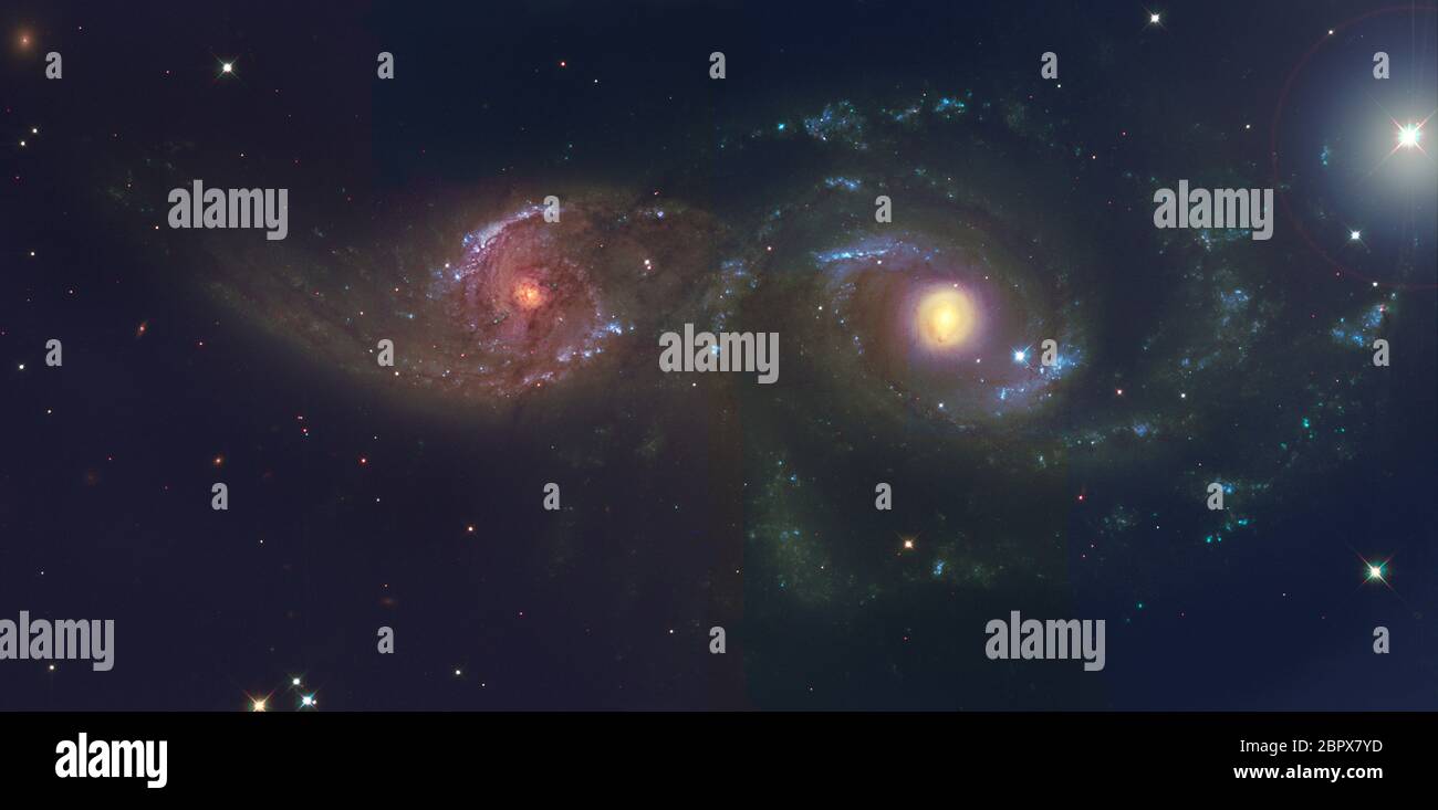 NGC 2207 e IC 2163 interagenti tra galassie in Canis Major. Credit: Immagine originale di ESA/Hubble, elaborazione e colorazione di file FITS monocromatici di Malcolm Park Foto Stock