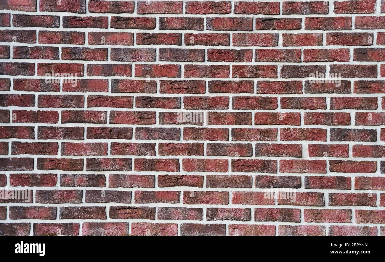 Muro di mattoni rossi. Muro di mattoni. Immagine di sfondo Foto Stock