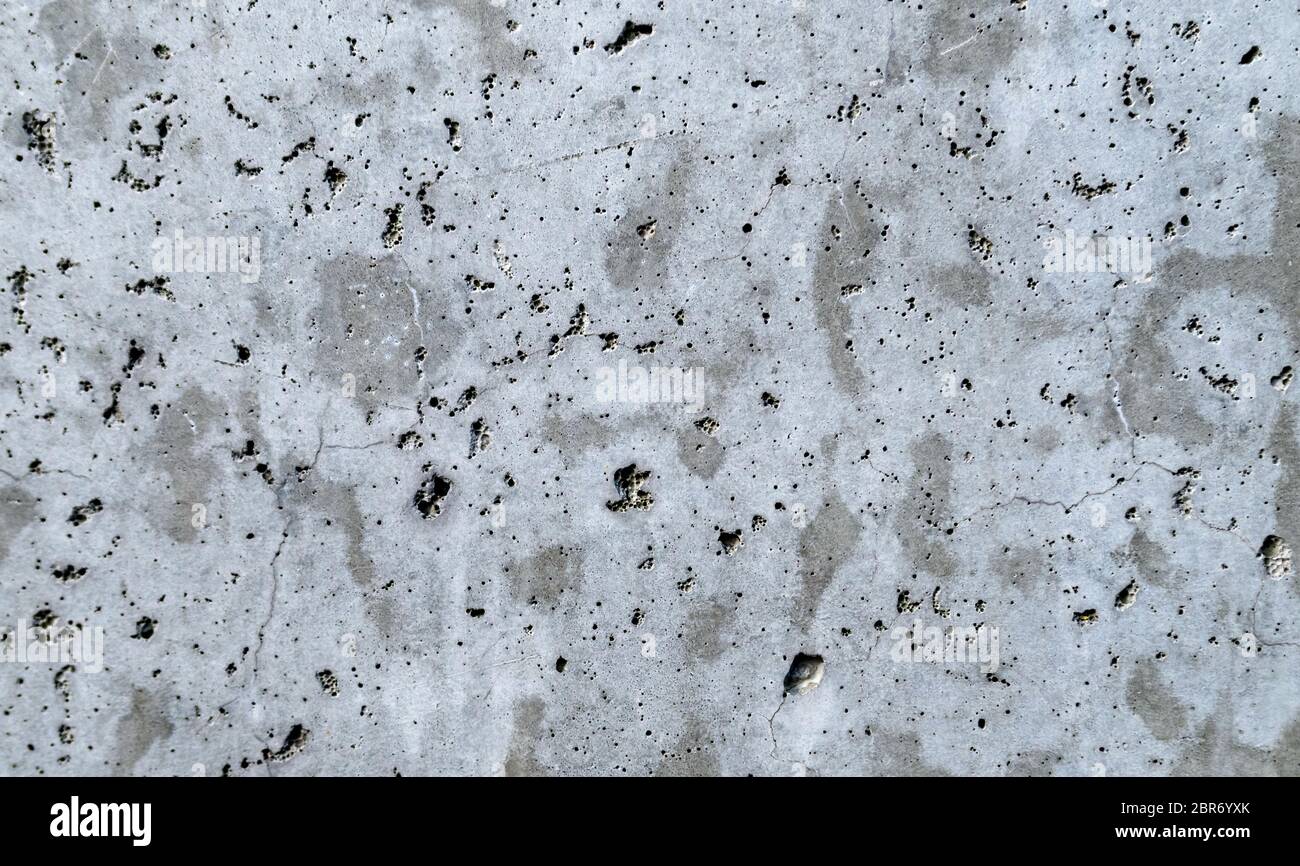 Una parete in cemento grigio intervallata da intonaco bianco. Sfondo.  Sfocatura astratta grigio cemento muro texture cemento per sfondo e carta  da parati Foto stock - Alamy
