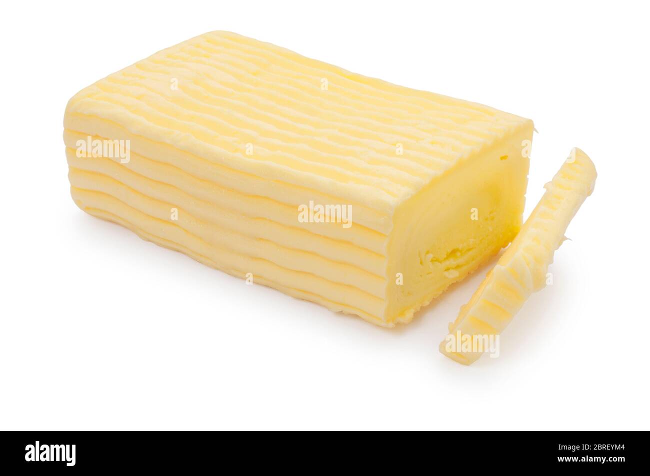 Studio di blocco di burro ricco e cremoso tagliato su sfondo bianco - John Gollop Foto Stock