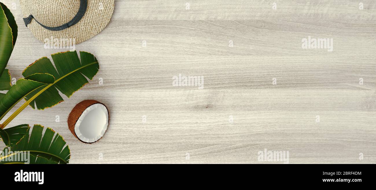 Composizione estiva. Foglie di palma tropicali, ananas, cocco e cappello da donna su sfondo di legno. Concetto estivo. Disposizione piatta, vista dall'alto, spazio per la copia. 3d Foto Stock